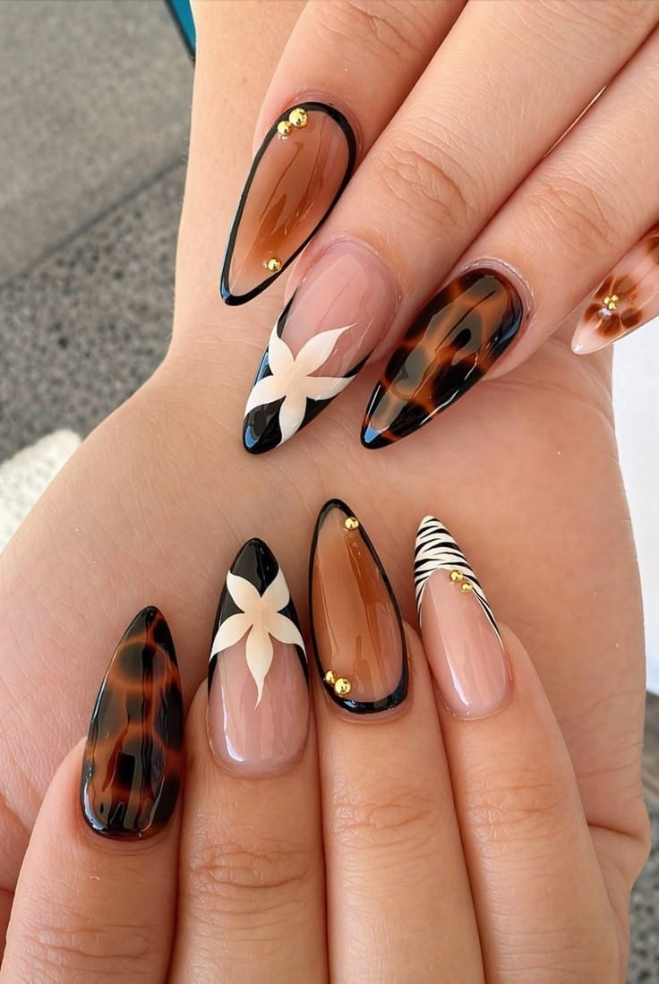 Tortoiseshell and floral almond nails by My Royal Nails & Spa in Humble, TX